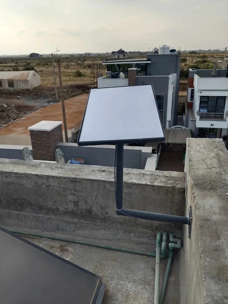 Spacekits residential Starlink installation Kenya with dish aligned above rooftop parapet