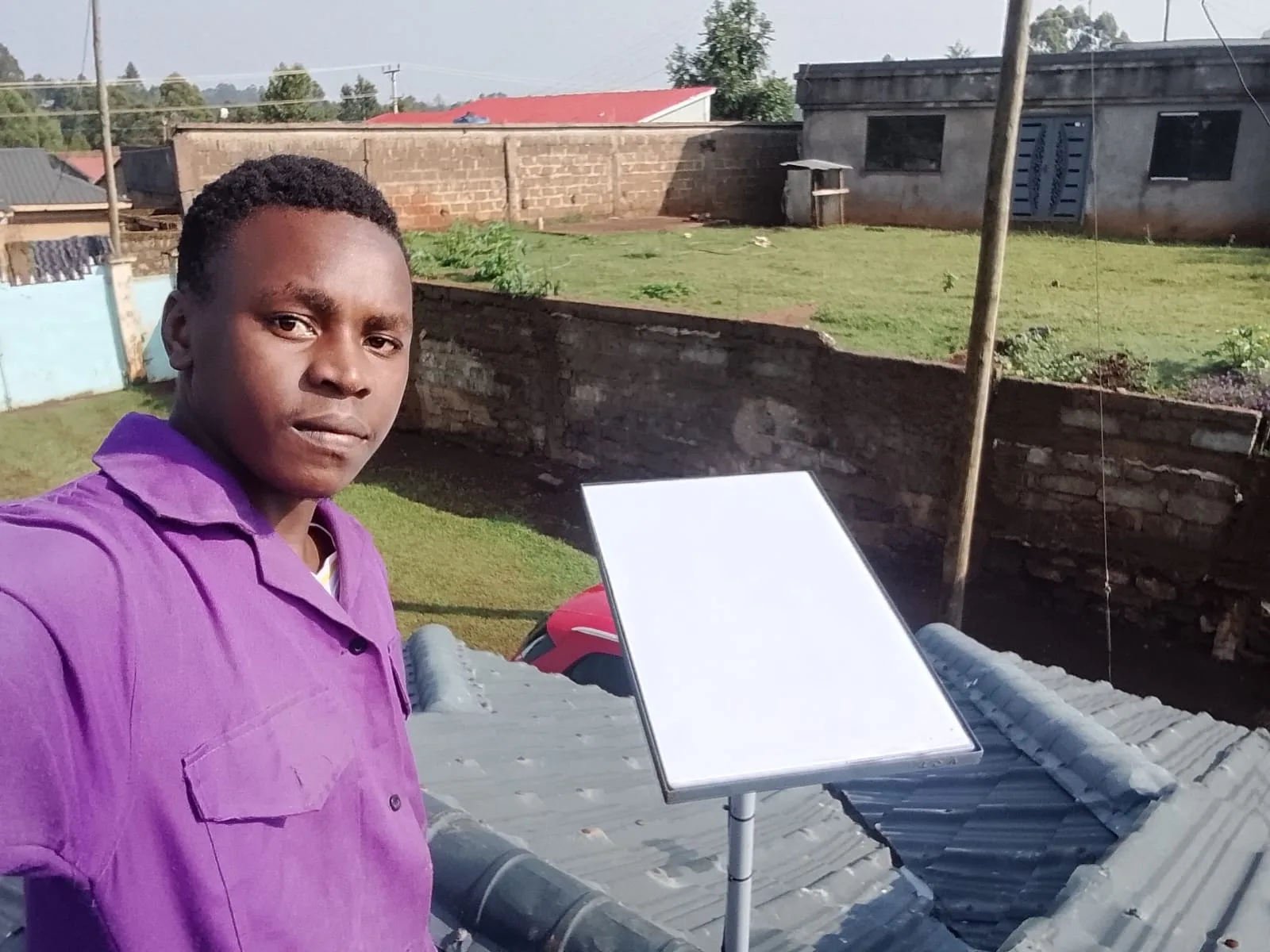 Spacekits installer handover after Starlink rooftop installation in Kenya, August 2026
