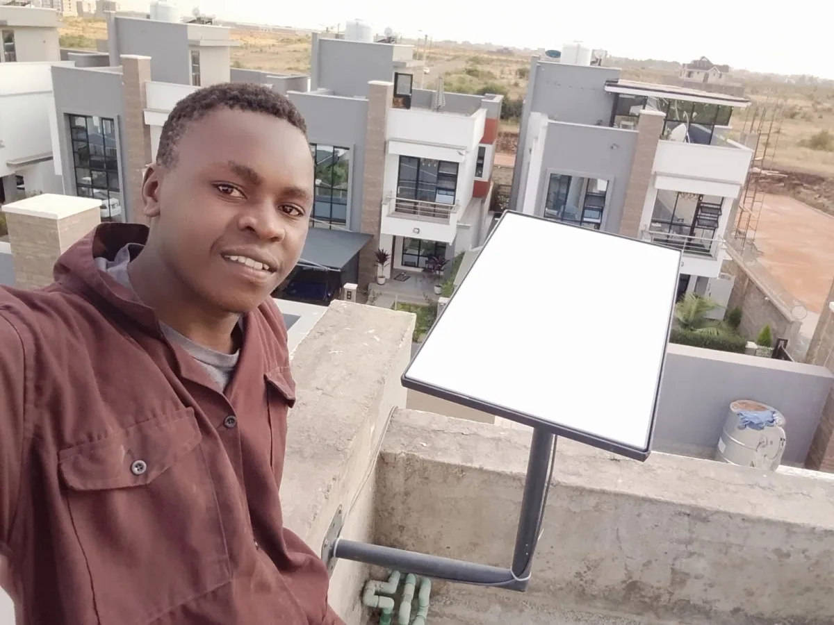 Spacekits installer after rooftop Starlink installation in Kenya